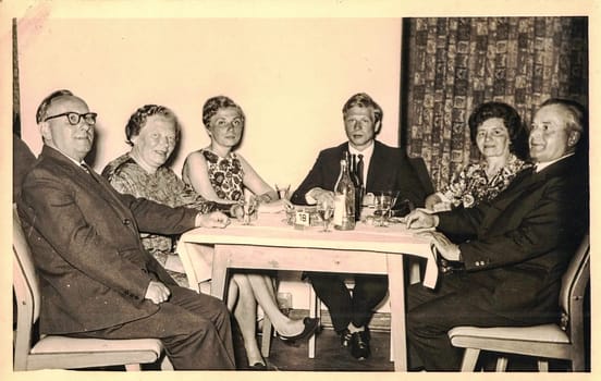 GERMANY - CIRCA 1970s: Retro photo shows social event - celebrating of New Year's Eve. Circa 1970s.