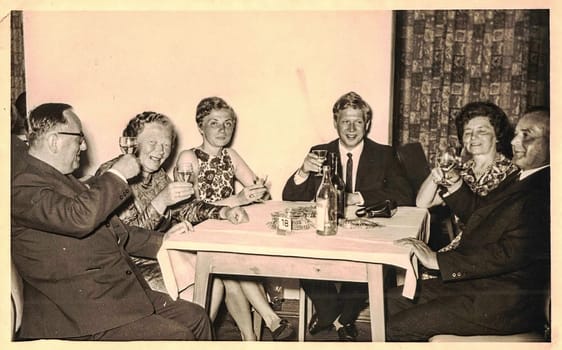 GERMANY - CIRCA 1970s: Retro photo shows social event - celebrating of New Year's Eve. Circa 1970s.