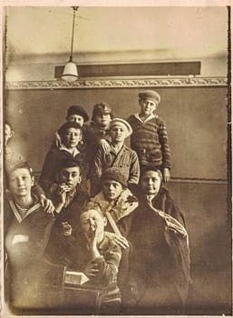 GERMANY - CIRCA 1920s: Vintage photo shows school boys in classroom. Vintage black and white photography.