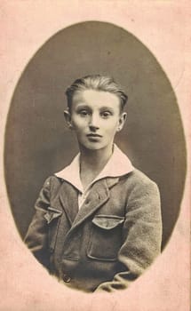 ZWICKAU, GERMANY - CIRCA 1930s: Vintage photo shows boy - teenager. Circa 13 year old. Studio black and white portrait