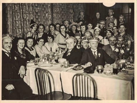 GERMANY - CIRCA 1950s: Retro photo shows social event - celebrating of New Year's Eve. Circa 1950s.