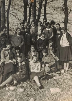 GERMANY 1927: Vintage photo shows group of girls pose outdoors. Black and white photo. Circa 1930s.