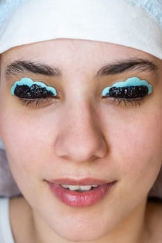 Close-up portrait of a woman on the procedure of lamination and tinting of eyelashes. Permanent makeup