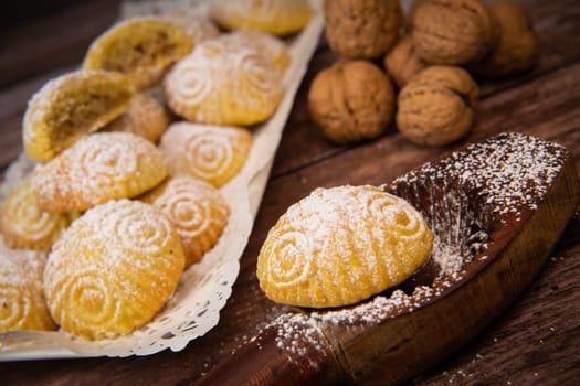 Traditional eid maamoul or mamoul cookies with dates, nuts, and jam, Arabic sweets for Aid al-Fitr and easter, High quality photo
