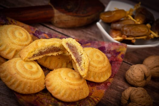 Traditional eid maamoul or mamoul cookies with dates, nuts, and jam, Arabic sweets for Aid al-Fitr and easter, High quality photo