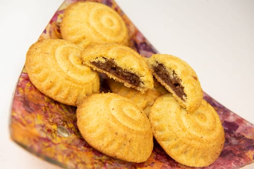 Traditional eid maamoul or mamoul cookies with dates, nuts, and jam, Arabic sweets for Aid al-Fitr and easter, High quality photo