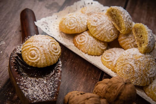 Traditional eid maamoul or mamoul cookies with dates, nuts, and jam, Arabic sweets for Aid al-Fitr and easter, High quality photo