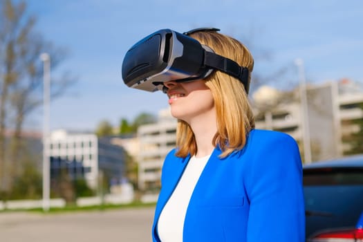 Woman with VR virtual reality goggles experiences a metaverse world. Augmented reality technology concept