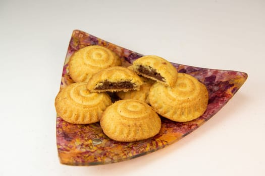 Traditional eid maamoul or mamoul cookies with dates, nuts, and jam, Arabic sweets for Aid al-Fitr and easter, High quality photo