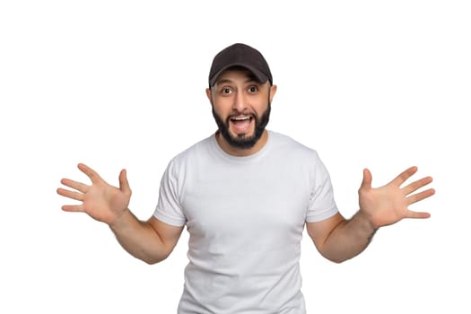 Portrait of young middle eastern bearded man with white t-shirt and cap looking at camera.