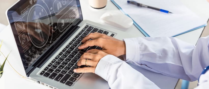 Doctor Day Concept. Nurse working using computer browsing internet, female doctor wear uniform in hospital typing information on keyboard laptop, Healthcare medical website technology online