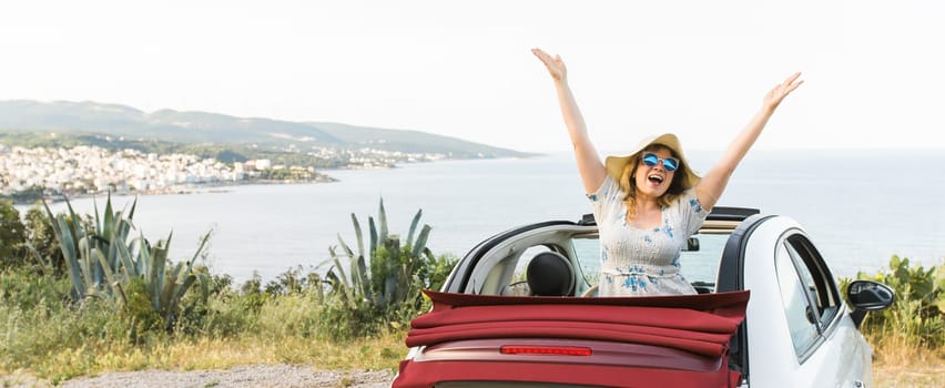 Young woman having fun in cabrio against a beach and sea - travel and summer voyage nature