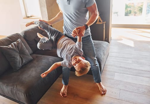 Positive emotions. Father and son is indoors at home together.