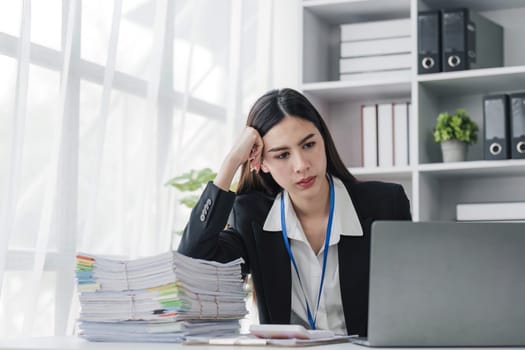 asian woman thinking hard concerned about online problem solution looking at laptop screen, worried serious asian businesswoman focused on solving difficult work computer task...