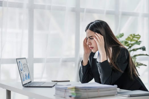 asian woman thinking hard concerned about online problem solution looking at laptop screen, worried serious asian businesswoman focused on solving difficult work computer task...