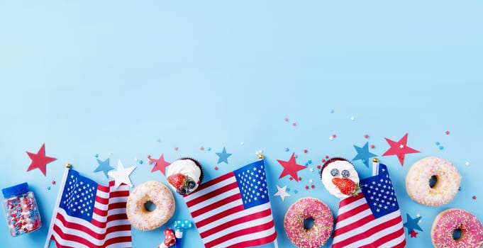 Fourth of july celebration. Sweet cupcakes and donuts with usa flag on blue background