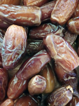 Large dried dates on the table close-up.Ripe dried dates.