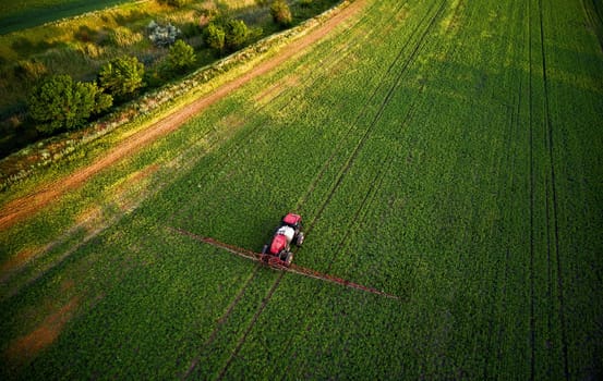 Sprayer CASE 3330 spraying pesticides on chickpea field. Field treatment with chemicals against pests, insects and plant diseases. Taking care of the Crop. 21.06.22, Rostov area. Russia