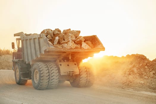 Beautiful sunshine. Loading vehicle is outdoors on the borrow pit at daytime. No people.