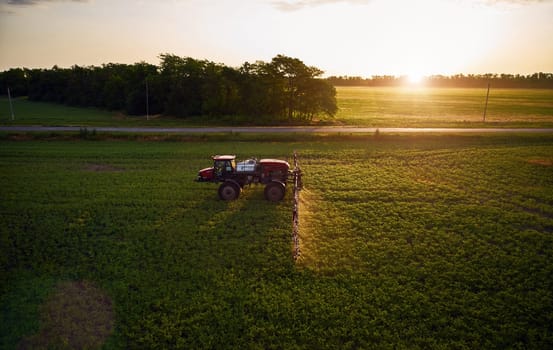 Sprayer CASE 3330 spraying pesticides on chickpea field. Field treatment with chemicals against pests, insects and plant diseases. Taking care of the Crop. 21.06.22, Rostov area. Russia