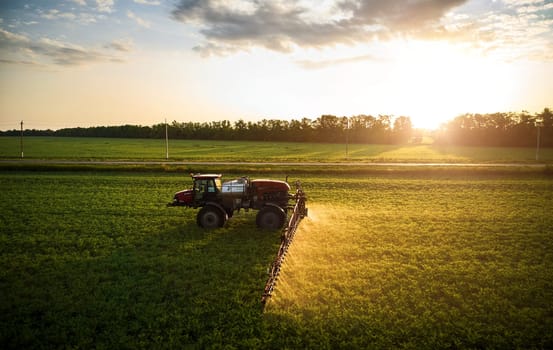 Sprayer CASE 3330 spraying pesticides on chickpea field. Field treatment with chemicals against pests, insects and plant diseases. Taking care of the Crop. 21.06.22, Rostov area. Russia