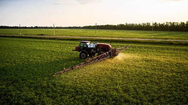 Sprayer CASE 3330 spraying pesticides on chickpea field. Field treatment with chemicals against pests, insects and plant diseases. Taking care of the Crop. 21.06.22, Rostov area. Russia