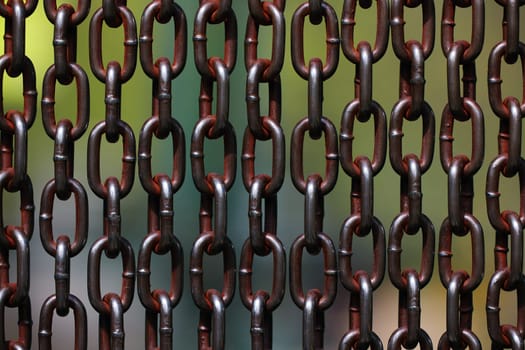 Background of metal chains, old used chain. Metal curtain on the entrance of bird park. The door made of chain link to prevent the bird fly away from the bird cage.