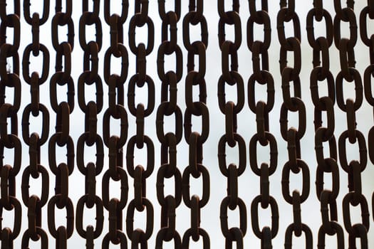 Rusty chains isolated on white. black and white concept. Background of chains on a withe background. Rust Anchor Chain. Curtain of old chain-link. Background of metal chains, old used chain.