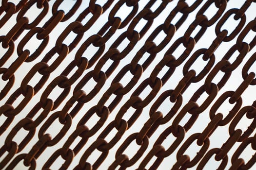 Rusty chains isolated on white. black and white concept. Background of chains on a withe background. Rust Anchor Chain. Curtain of old chain-link. Background of metal chains, old used chain.