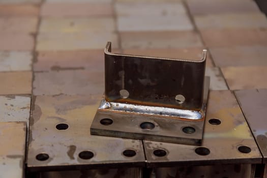 Welding of metal fasteners at a metalworking plant.