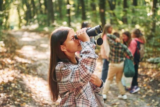 Discovering new places. Kids in green forest at summer daytime together.