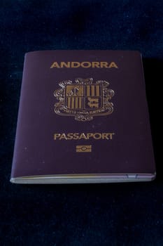 Passport of the Principality of Andorra on a black background.