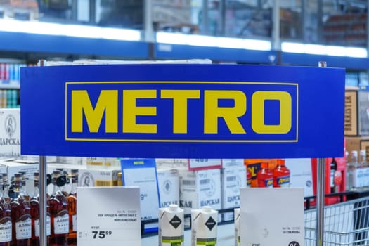 Tyumen, Russia-February 25, 2023: Metro logo of a supermarket. Metro cash and carry is a leading international company