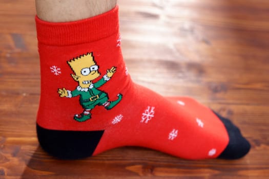 Tyumen, Russia-January 23, 2023: Bart Simpson from The Simpsons animated series logo on clothes, Christmas socks