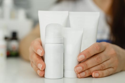 Cream tubes for hands and feet on a white background. Isolated