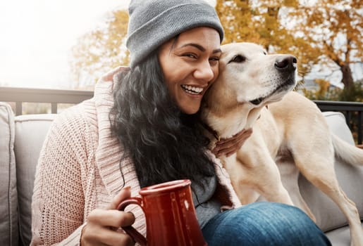 Pets make our lives whole. a young woman relaxing with her dog outside