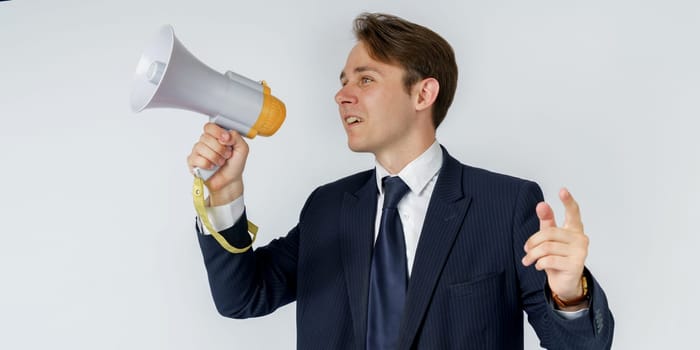 Portrait of a businessman who holds a jacket on his shoulder. The face is not visible. White background.