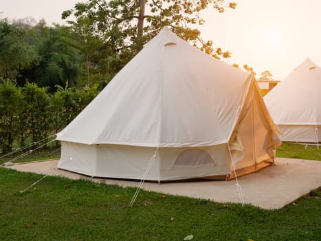 Camping picnic tent campground in outdoor hiking forest. Camper while campsite in nature background at summer trip camp. Adventure Travel Vacation concept