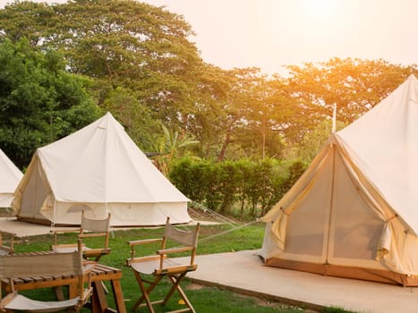 Camping picnic tent campground in outdoor hiking forest. Camper while campsite in nature background at summer trip camp. Adventure Travel Vacation concept