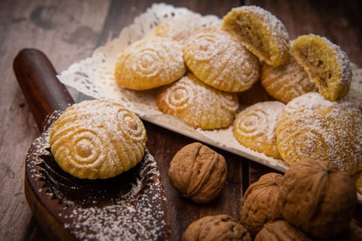 Traditional eid maamoul or mamoul cookies with dates, nuts, and jam, Arabic sweets for Aid al-Fitr and easter, High quality photo