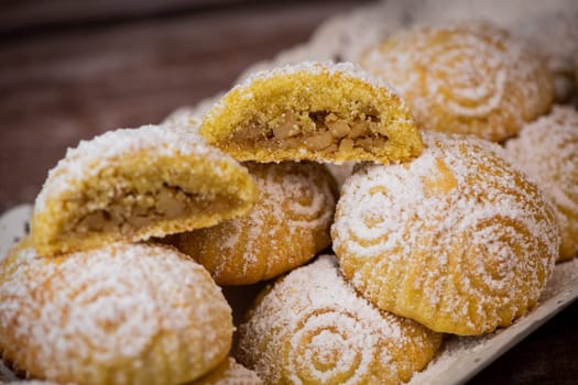Traditional eid maamoul or mamoul cookies with dates, nuts, and jam, Arabic sweets for Aid al-Fitr and easter, High quality photo