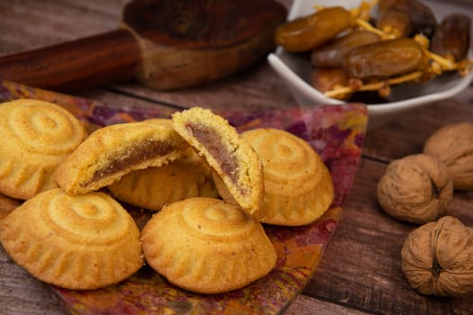 Traditional eid maamoul or mamoul cookies with dates, nuts, and jam, Arabic sweets for Aid al-Fitr and easter, High quality photo