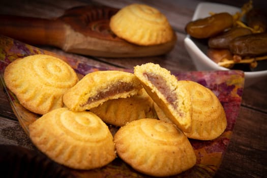 Traditional eid maamoul or mamoul cookies with dates, nuts, and jam, Arabic sweets for Aid al-Fitr and easter, High quality photo