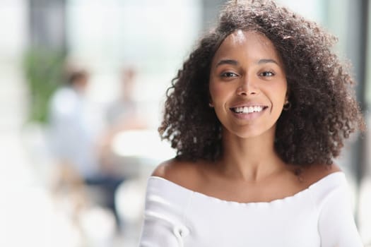 Portrait of an African American young business woman working in the office