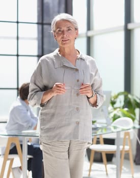 mature woman closeup hands together in the office.