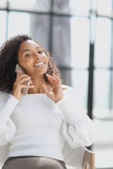 Portrait of a young African American woman using a smartphone