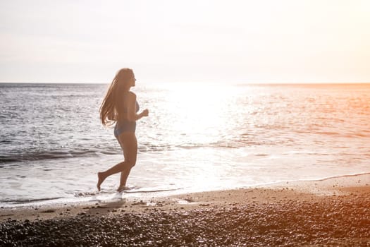 Running woman. Female runner jogging during the sunrise on beach. Woman Runner feet running on the beach at sunrise. woman fitness sunrise jog workout wellness concept.