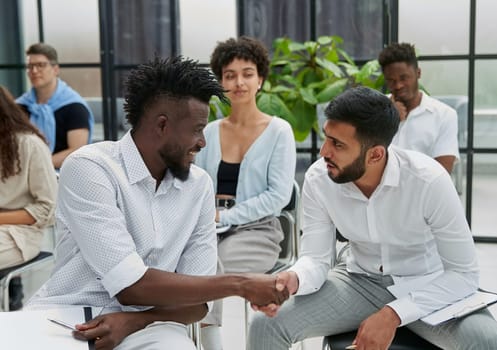 Business people sharing expressions after lecture in conference room