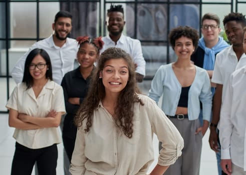 Team at work. Group of young business people in smart casual wear working together in creative office