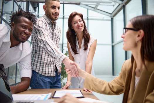 Manager interviewing job seeker in modern office